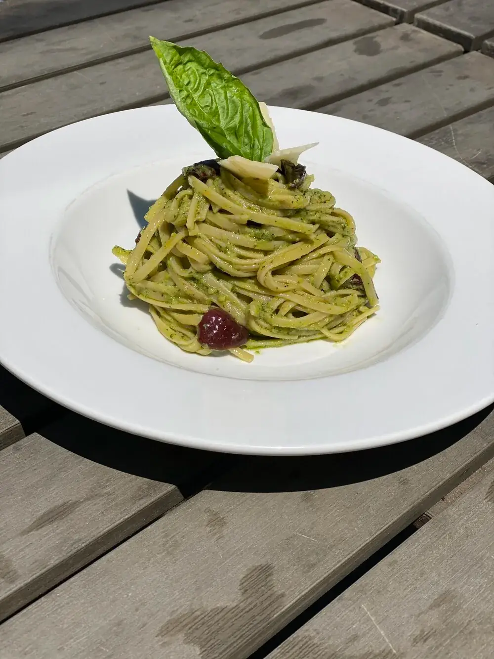 Fresh avocado and basil pesto, kalamata olives Parmesan cheese and linguine pasta.