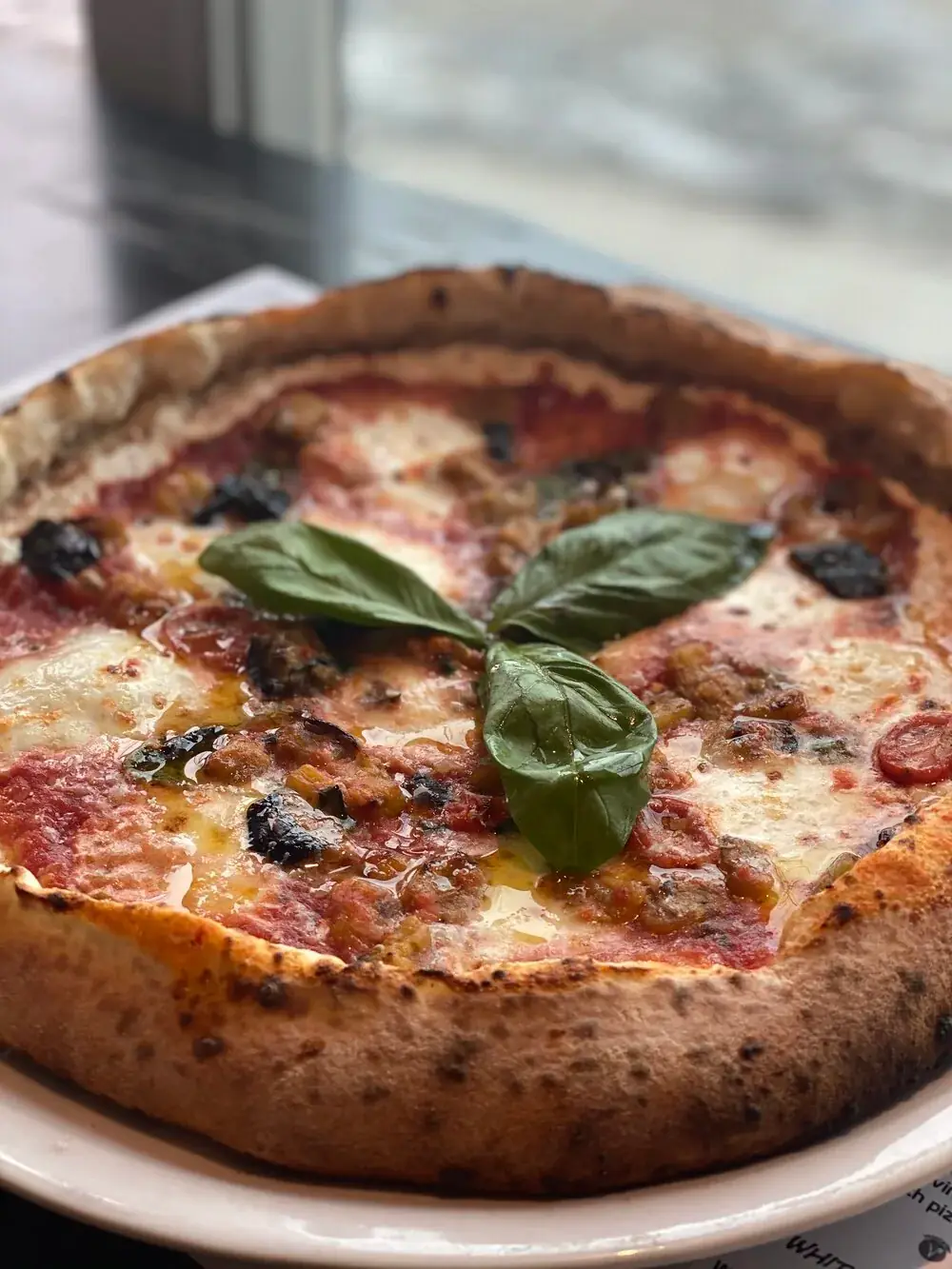 Fresh eggplant Caponata, Ontario buffalo mozzarella with a stuffed ricotta crust (Vegan option available)