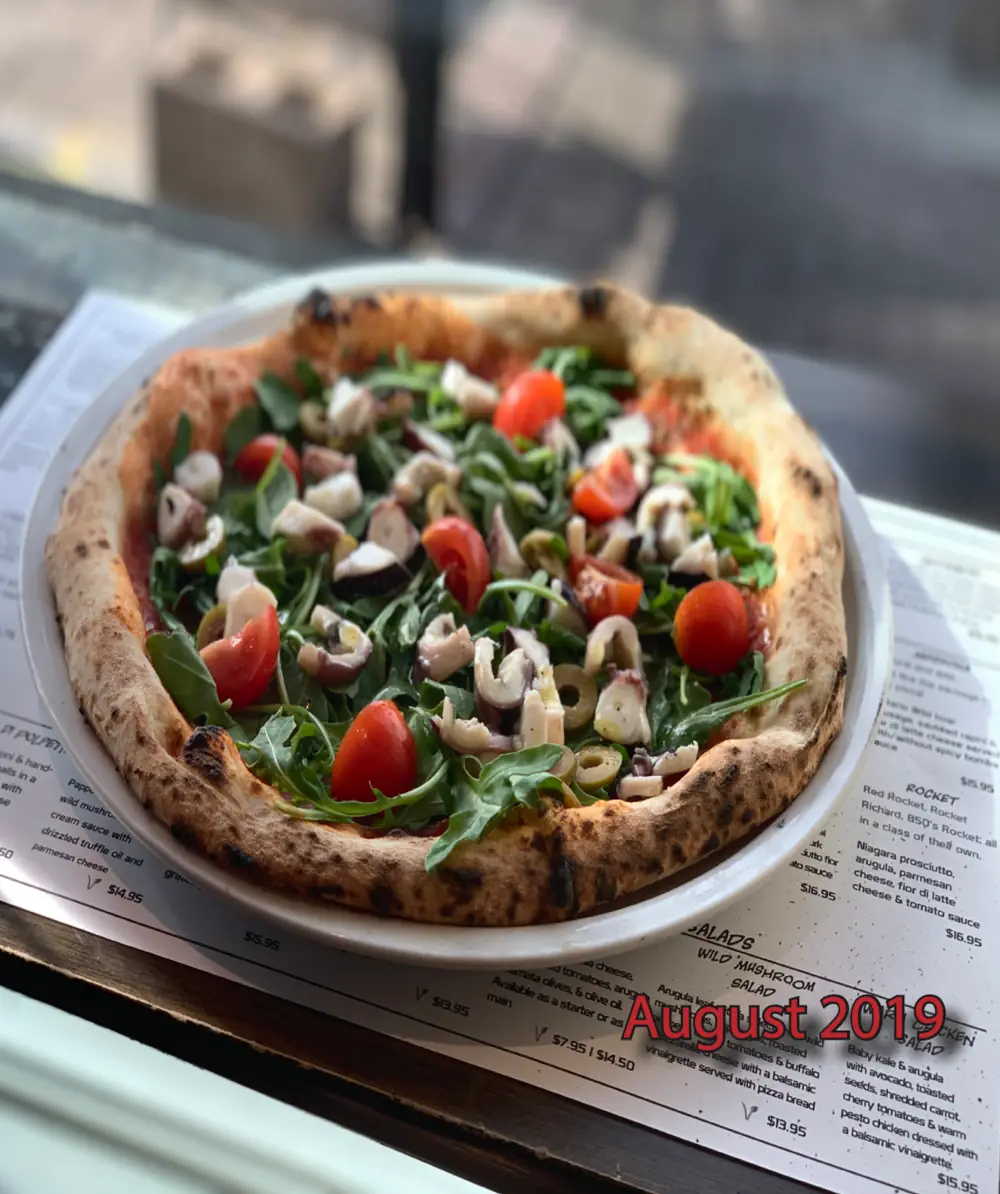 Spicy marinated octopus, arugula, cherry tomatoes and green olives